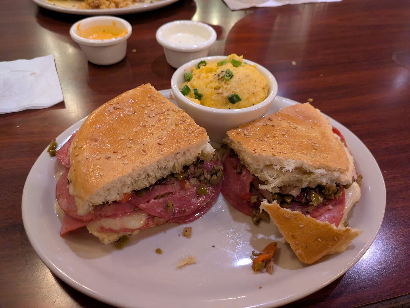 Muffuletta bread loaded with salami, ham, mortadella, olive salad, Swiss cheese & provolone cheese. Served Hot or Cold