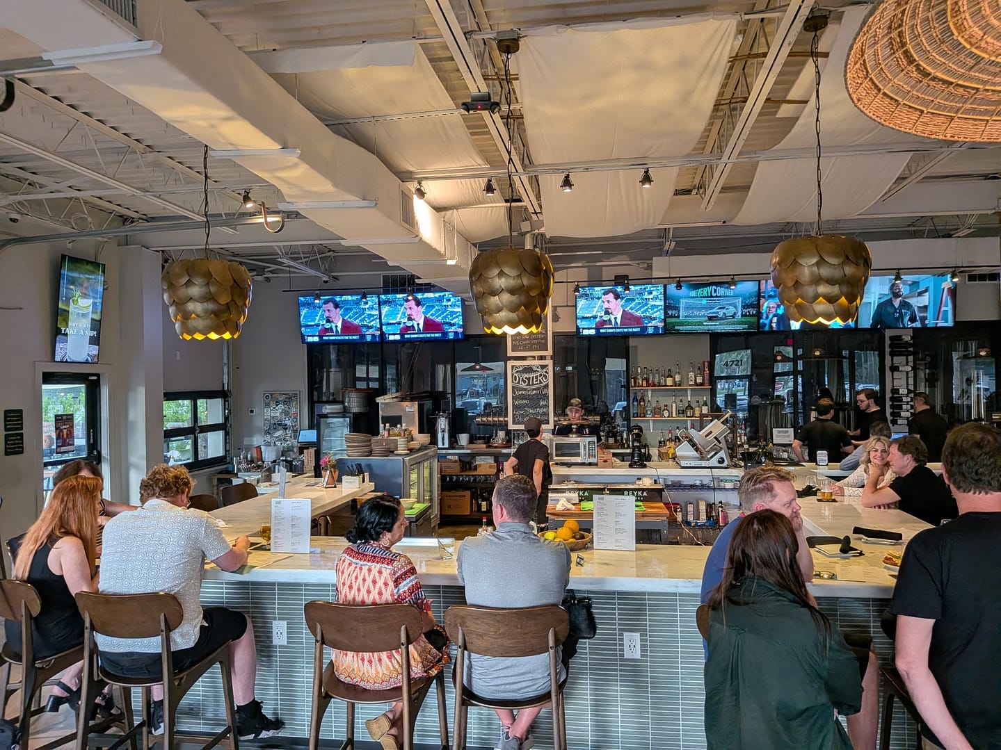 The large bar at Runabout Brewing with hop-shaped pendant lights