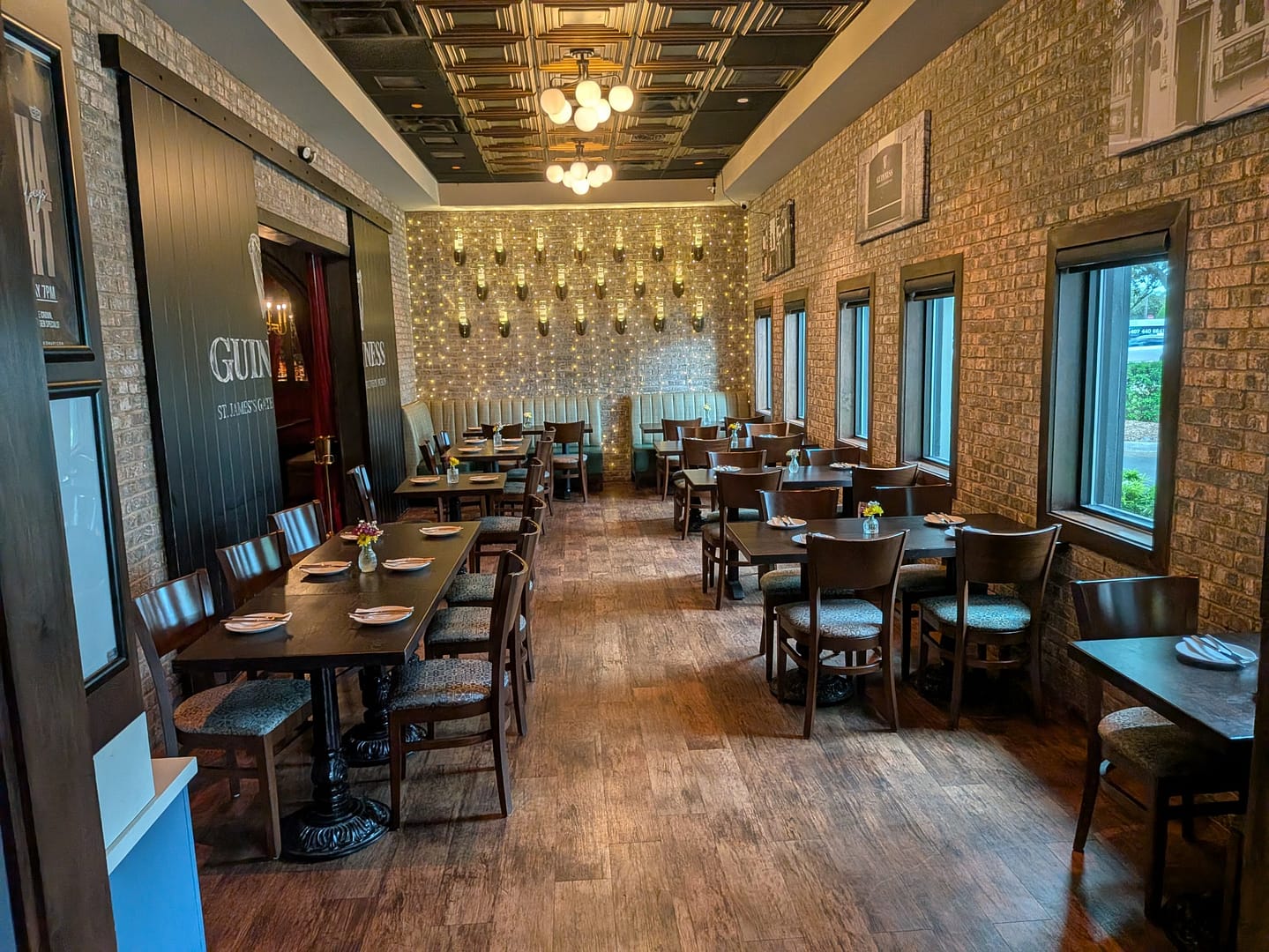 Dining room at Grafton Street Pub with brick walls and fairy lights