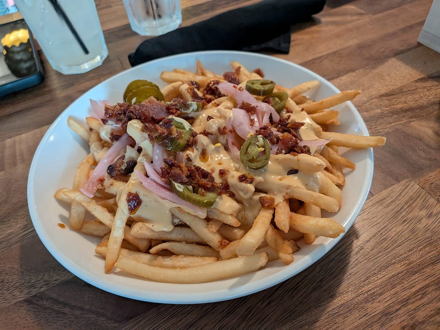 Loaded cheese fries with bacon and jalapenos at Runabout Brewing