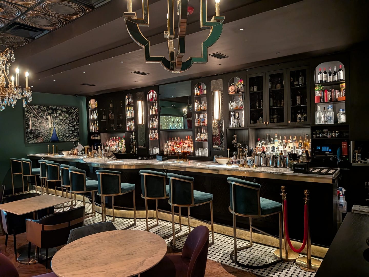 The bar at Grafton Street Pub Lake Mary with marble counter and chandeliers
