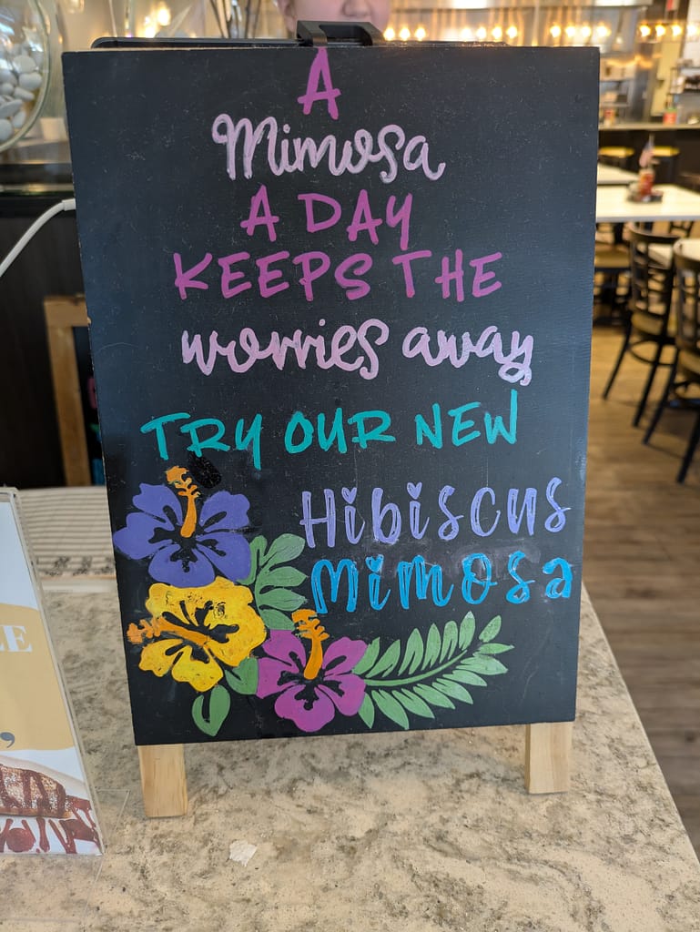 Mimosa a Day Keeps the Worries Away sign